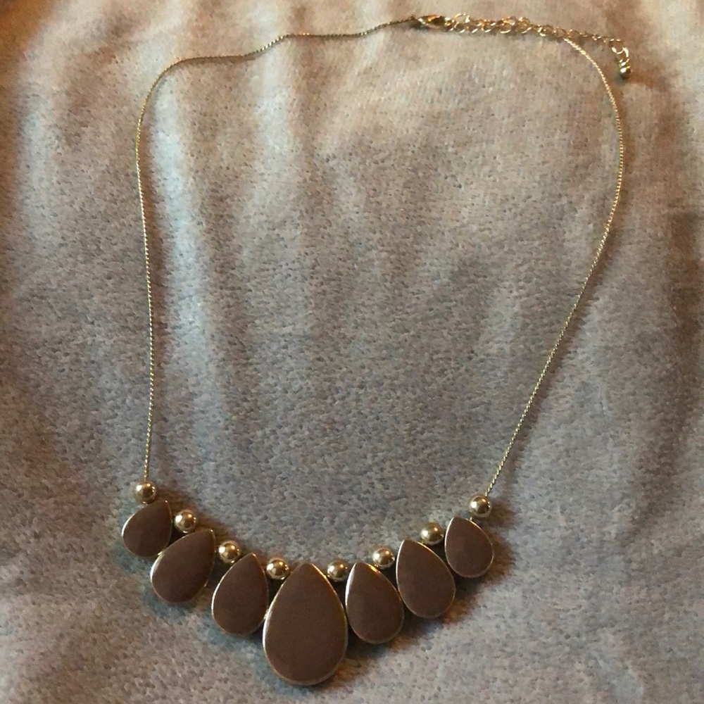 Gold and taupe colored necklace